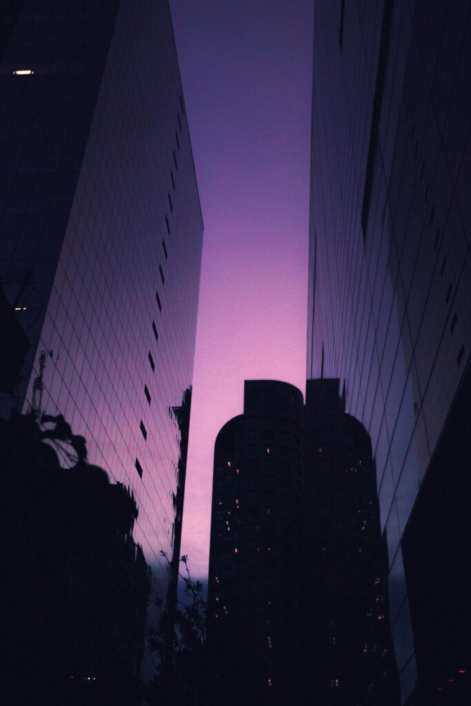 Stunning São Paulo cityscape with skyscrapers silhouetted against a purple twilight sky.